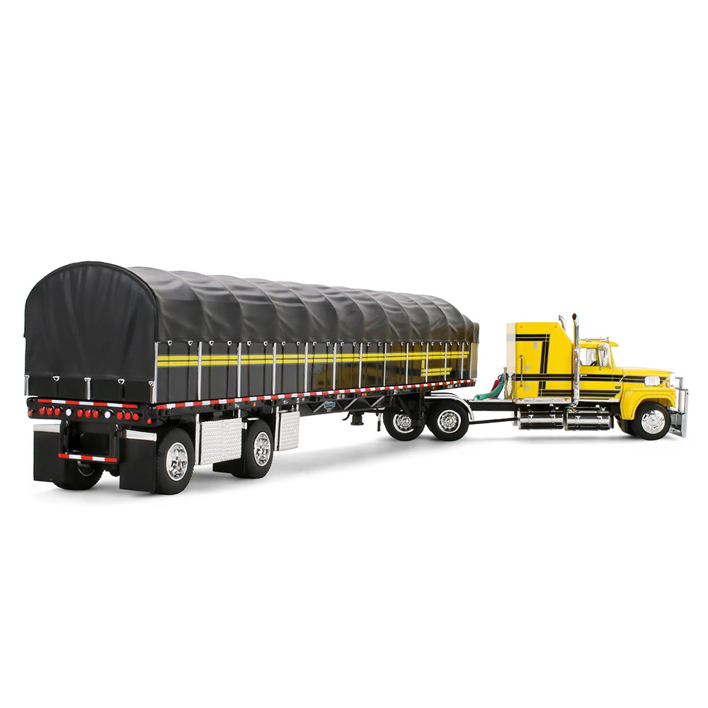 Yellow/Black Ford LTL 9000 with 60" Aerodyne Sleeper & 53' Wilson Roadbrute Flatbed Trailer with Covered Wagon